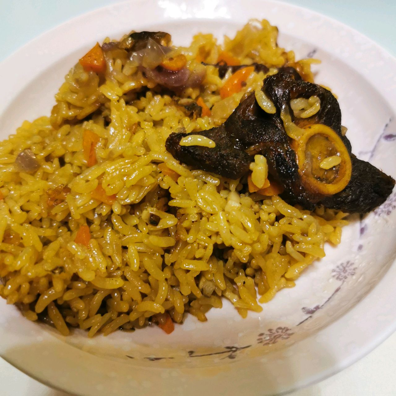 Stewed rice with lamb chops