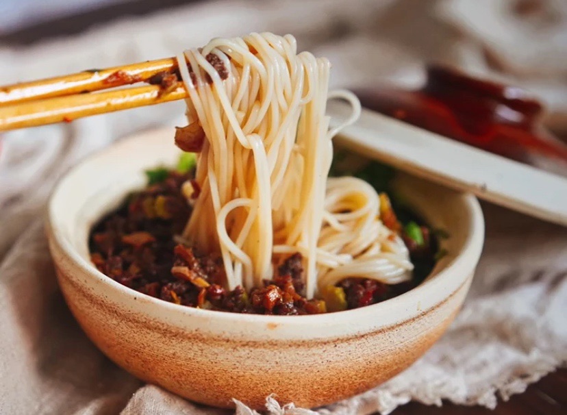 Beef and rice noodles with pickled peppers