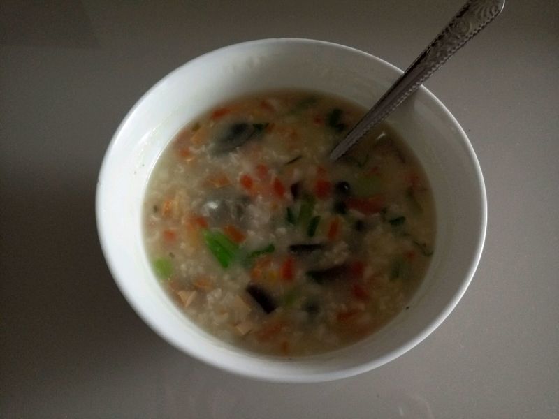 Congee with preserved eggs and vegetables