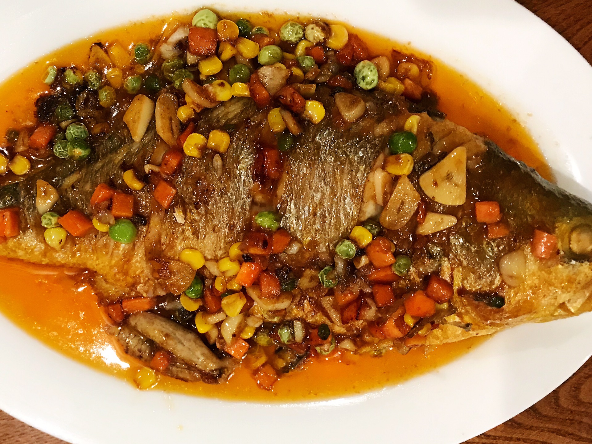 Yellow croaker in tomato sauce