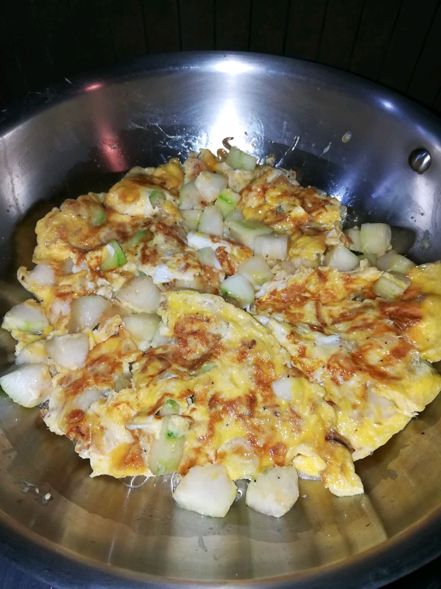 Fried egg with shrimp and zucchini