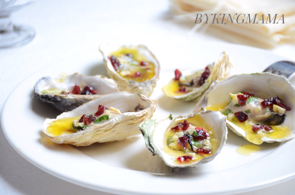 Baked oyster with cranberry and cream