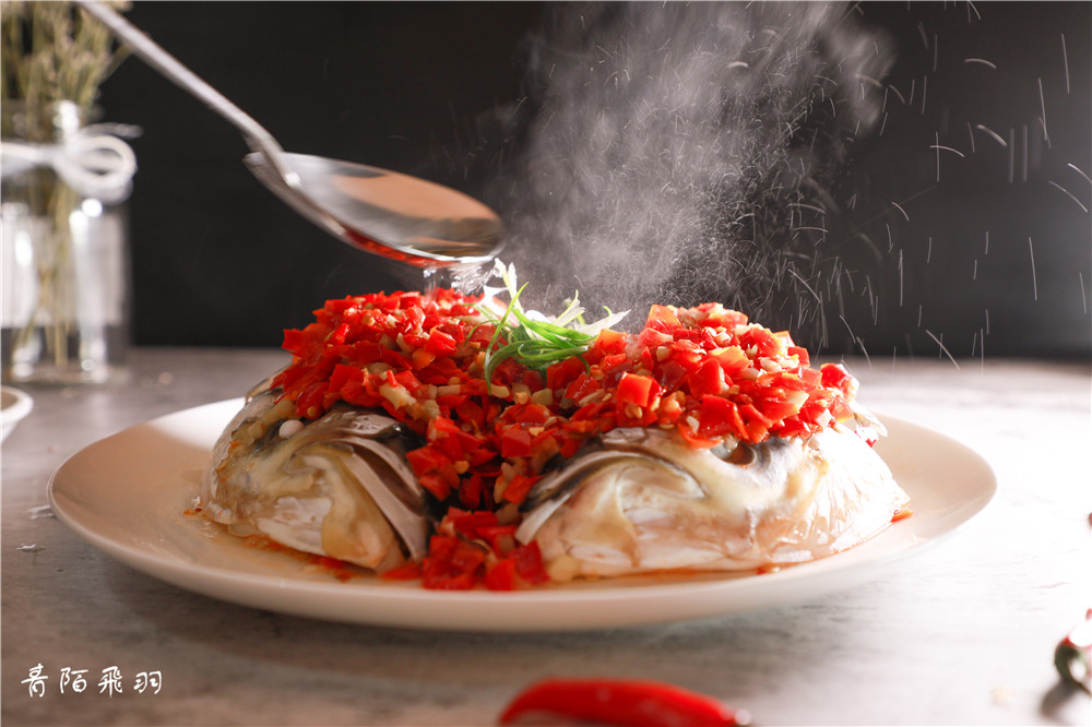 Fish head with chopped peppers