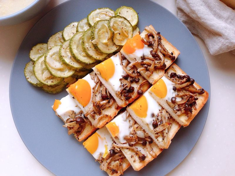 Toast with mushroom, egg, toast and zucchini