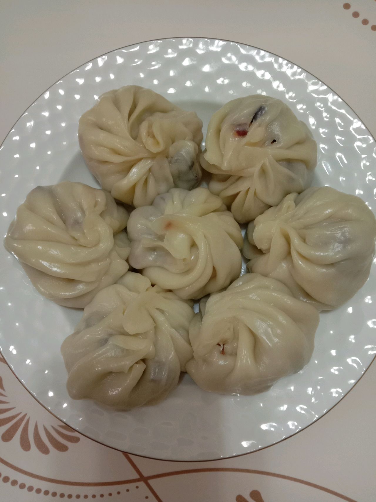 Steamed bun with preserved pork and bamboo shoots