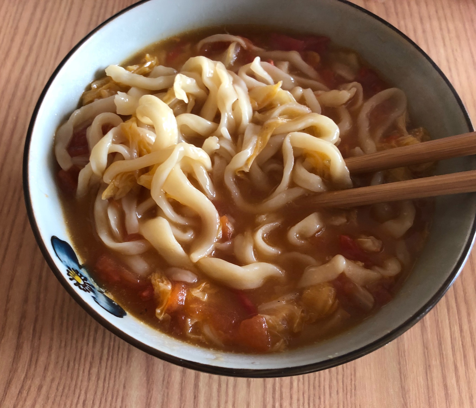 Hand rolled noodles with tomatoes