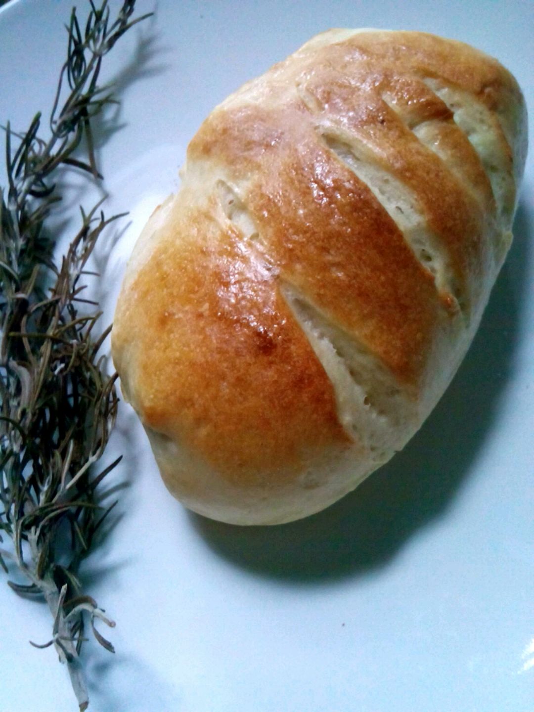 Sweet bread with butter and rosemary