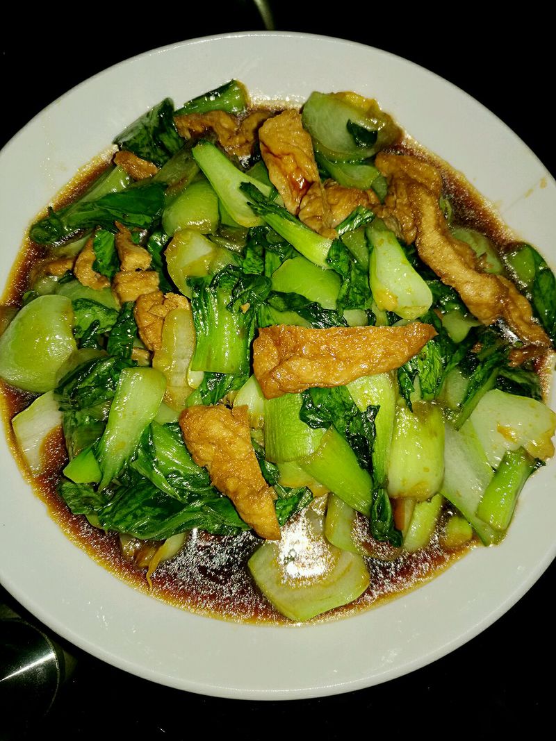 Stir fried rape with chicken legs